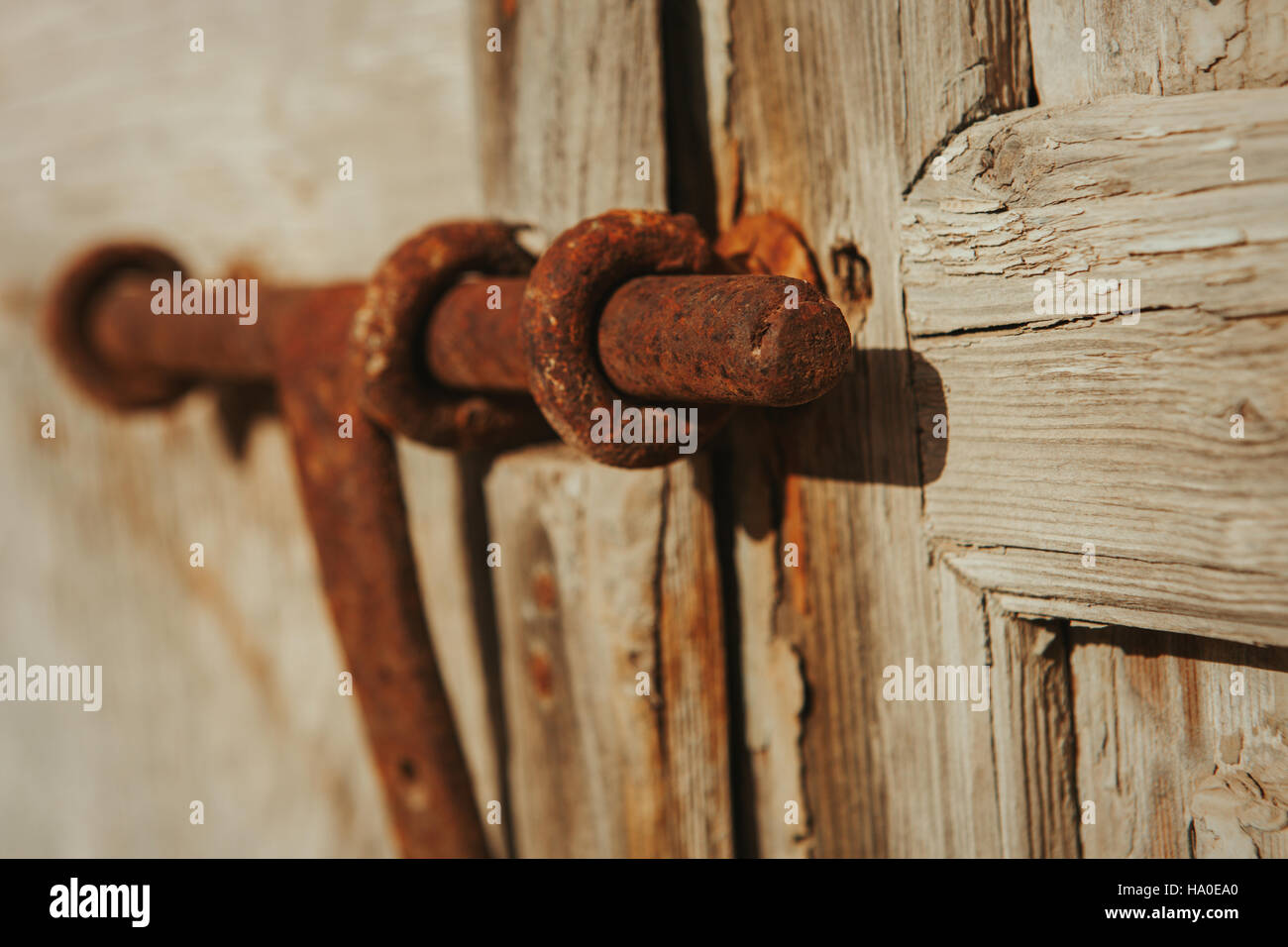 Closed rusty on an old wooden door Stock Photo - Alamy