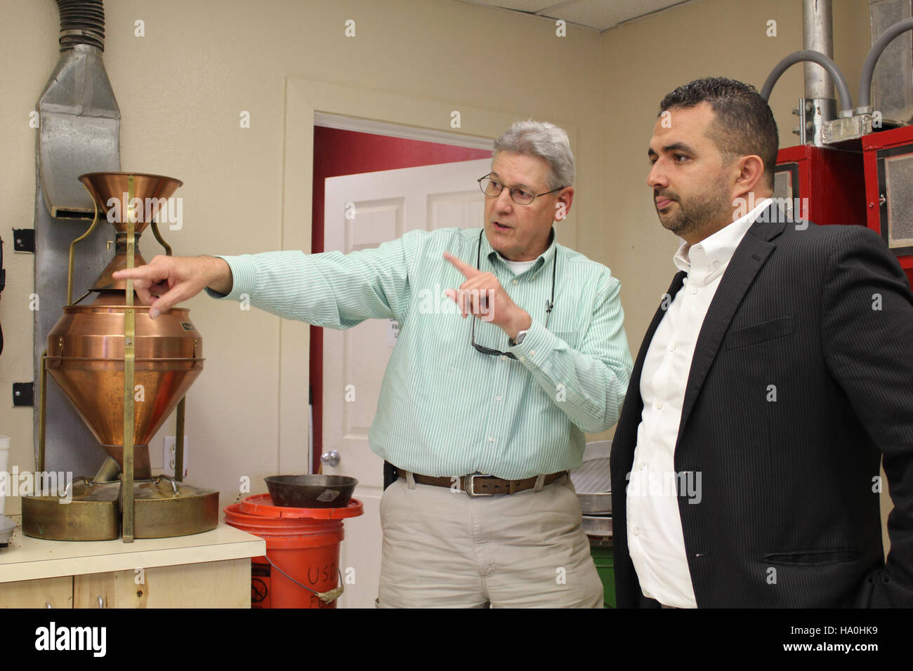 usdagov 19551524936 Deputy Undersecretary of Agriculture Elvis Cordova (right) touring a grading laboratory during a recent visit to GIPSA facilities in League City, Texas and Stock Photo