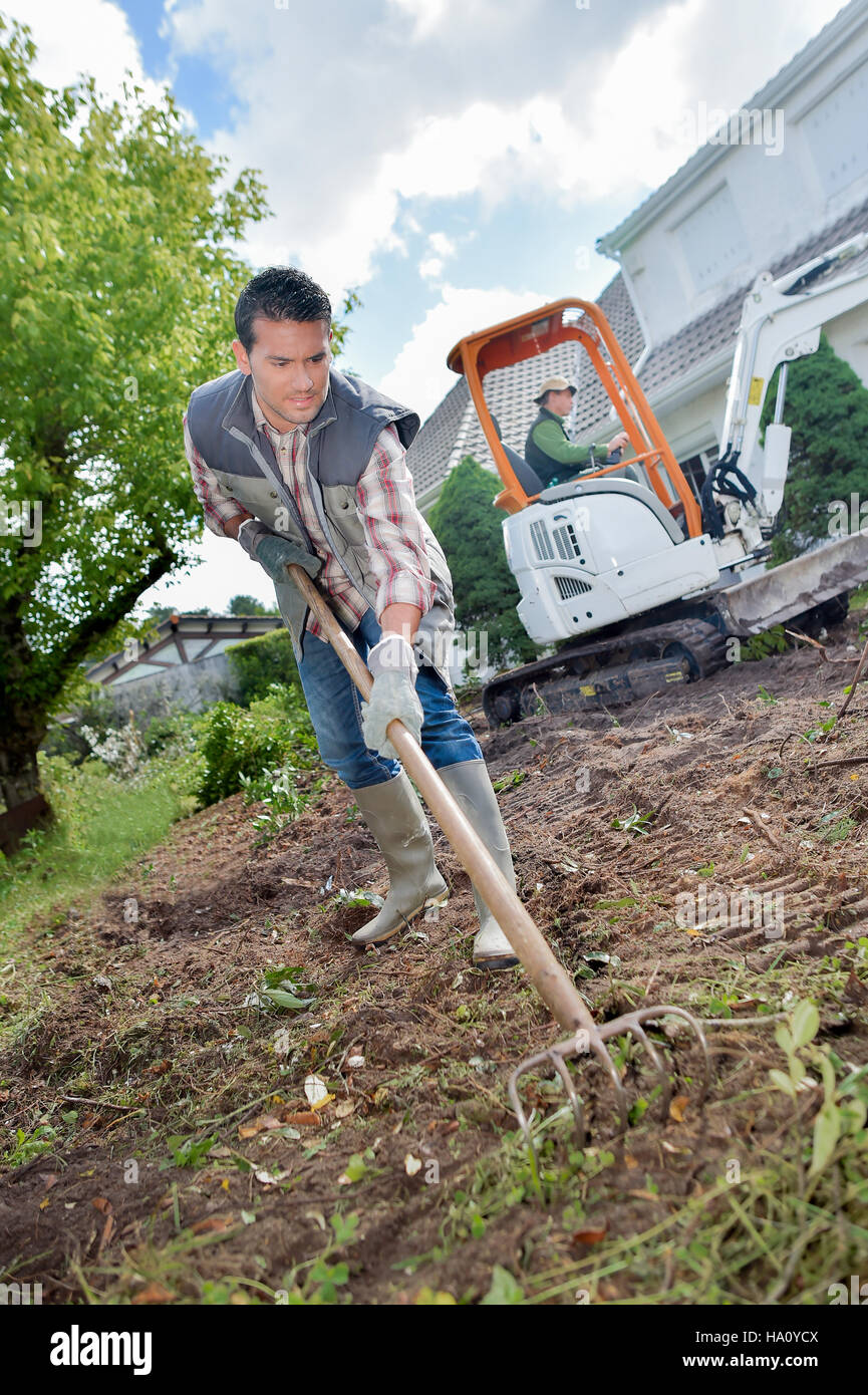 Gardener using a rake Stock Photo
