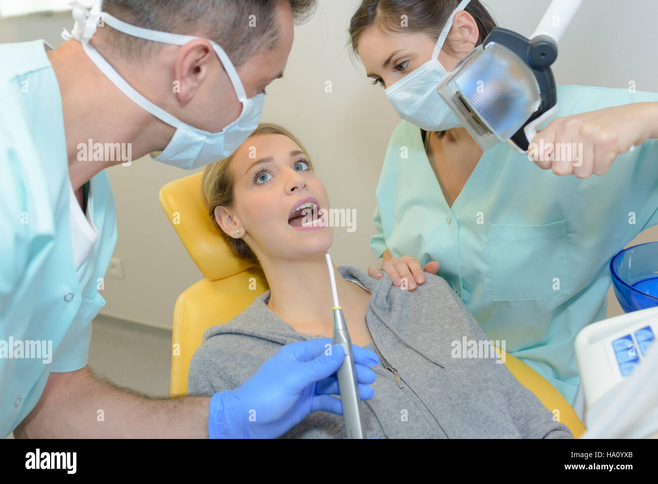 dentist checking a clients gums Stock Photo Alamy