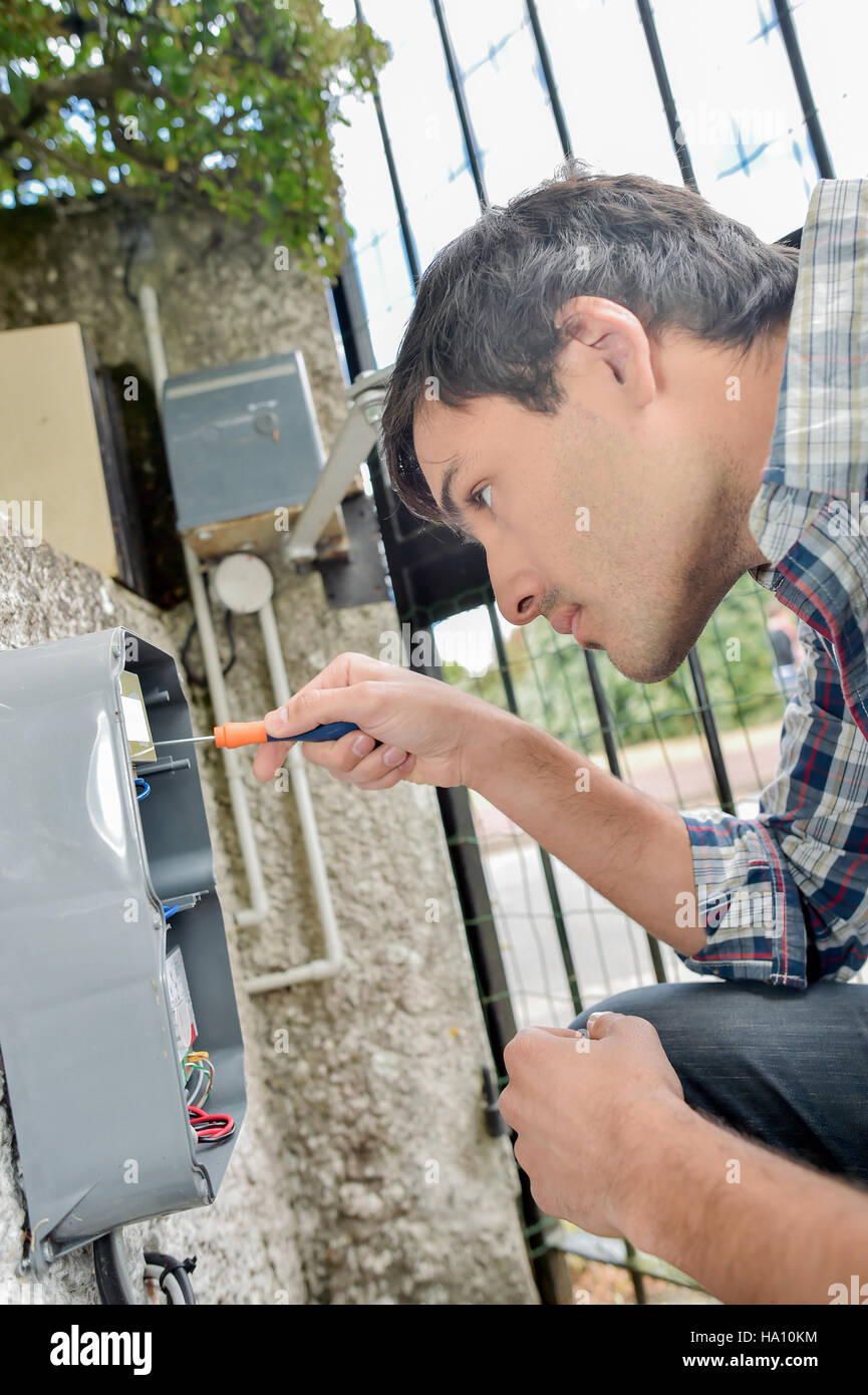 Electrician repairing an system Stock Photo Alamy