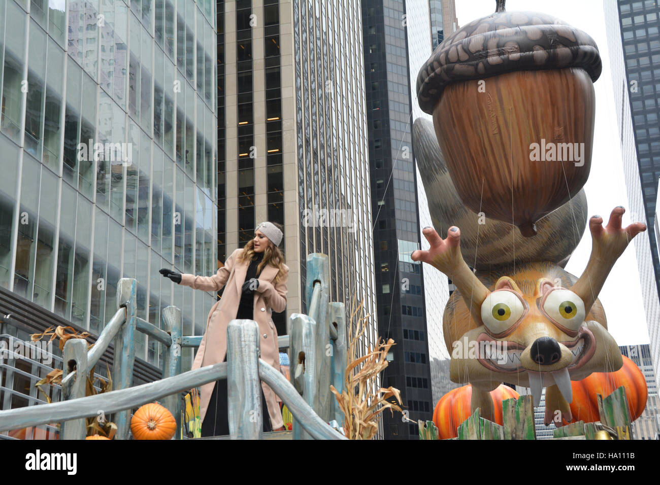 Singer Daya and Scrat and his Acorn balloon in the Macy's Thanksgiving Day Parade going down the Avenue of the Americas Stock Photo
