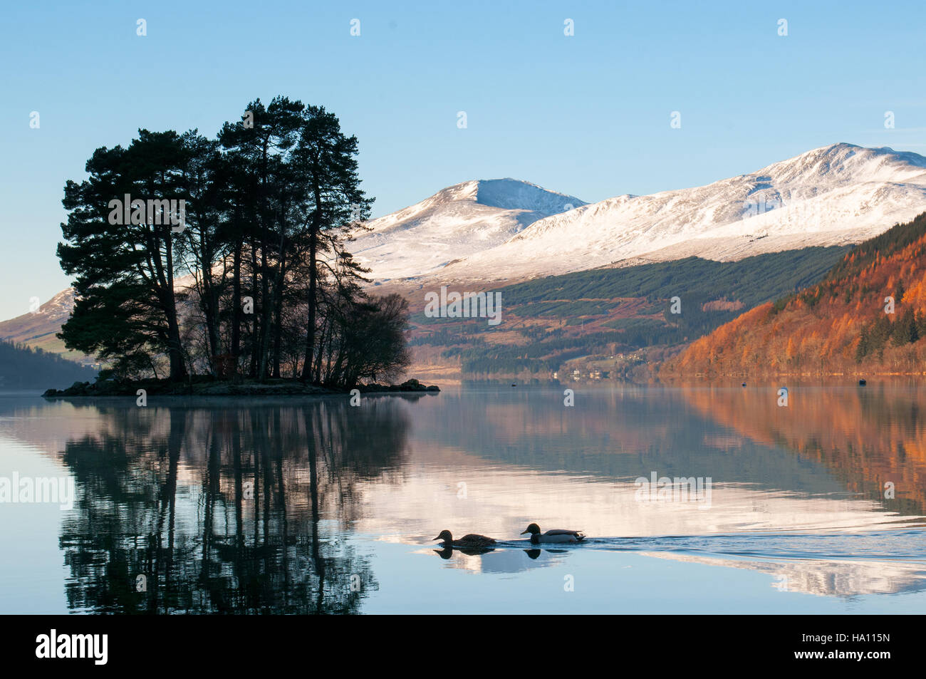 Loch Tay, Kenmore, Perthshire, Scotland, UK with the sun shining on the snowy mountains of the Lawers range in the background Stock Photo