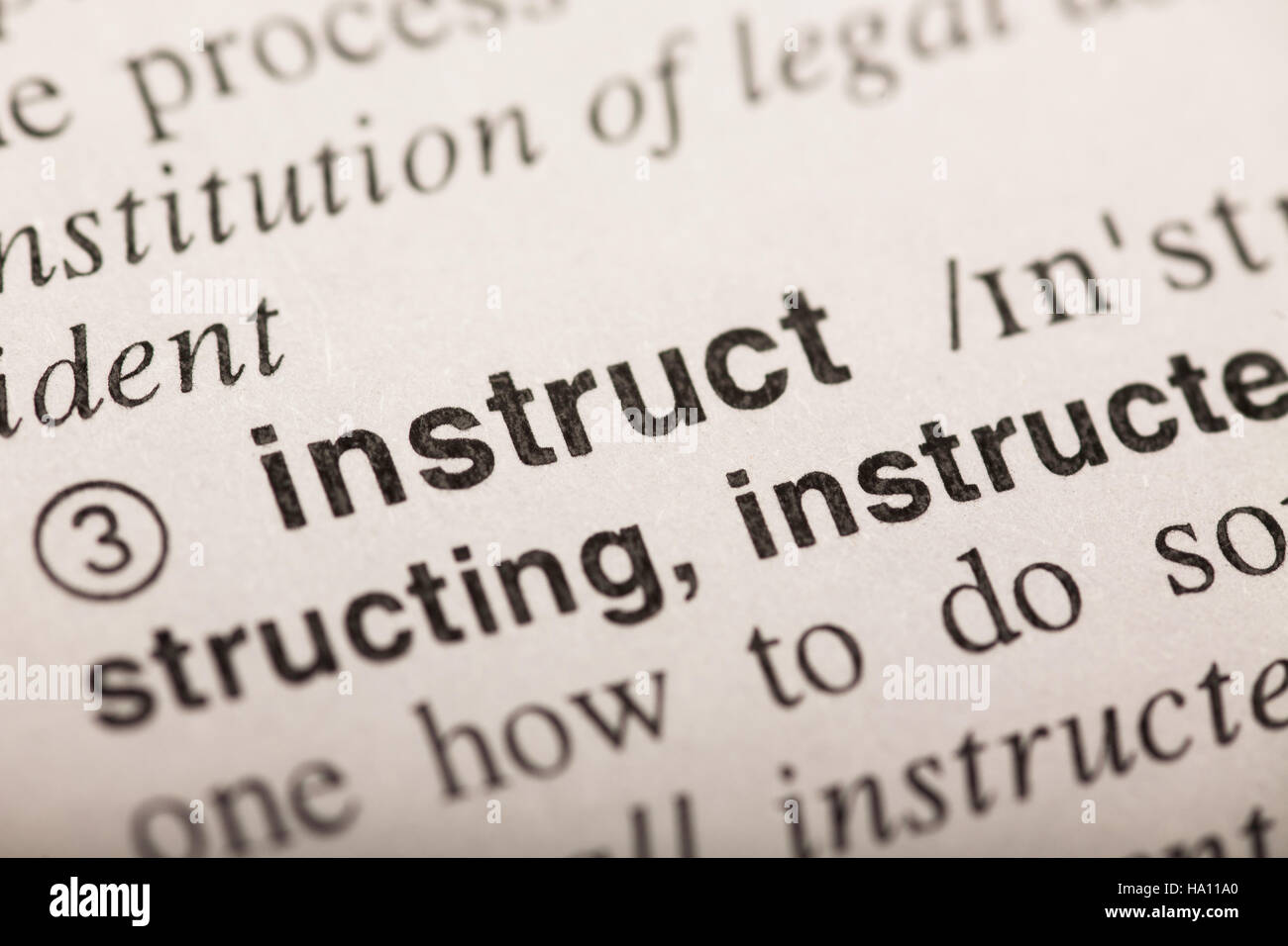 instruct - word in dictionary Stock Photo