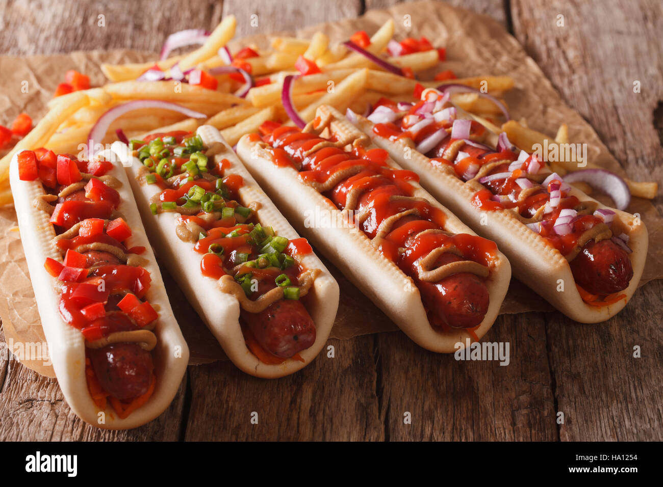 hot dogs with ketchup, mustard and french fries closeup on the table. horizontal Stock Photo