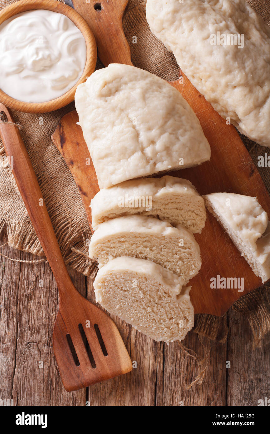 Traditional sliced yeast knodel close-up on the table. vertical view from above Stock Photo