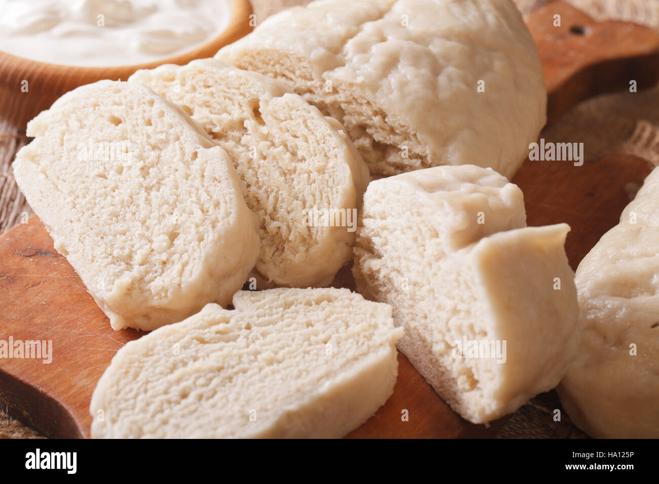 Traditional sliced yeast knodel close-up on the table. Horizontal Stock Photo