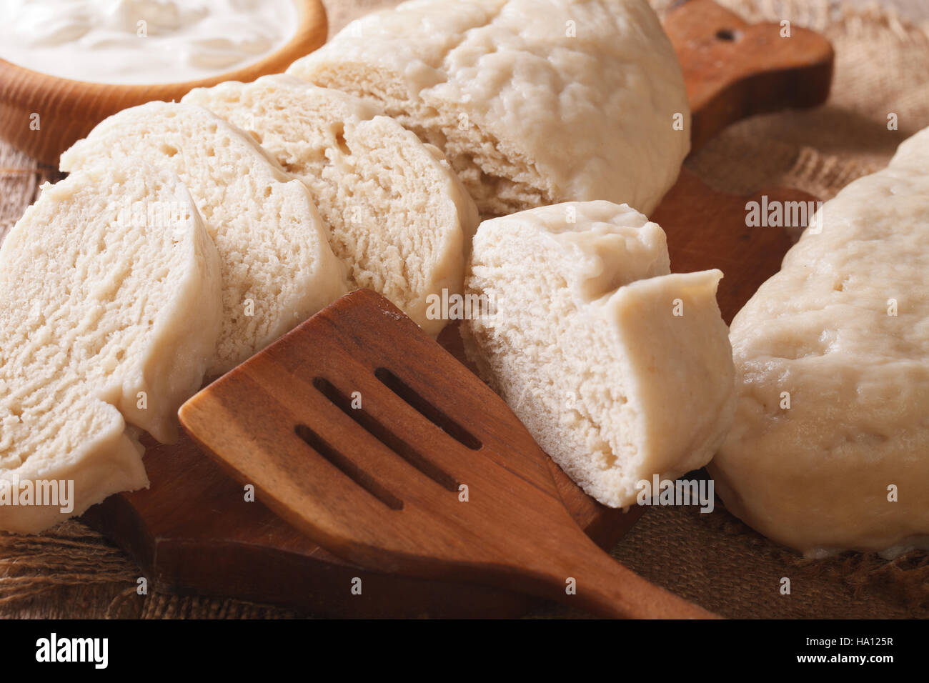 Czech knedliks sliced close-up on chopping board. horizontal Stock Photo