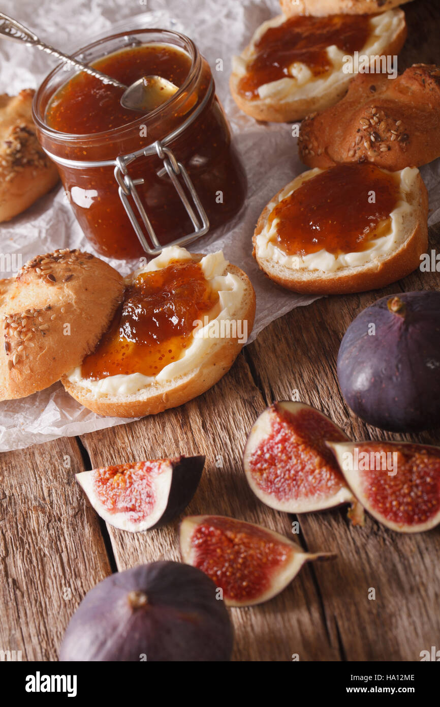 buns with fig jam and cream cheese closeup on the table. vertical