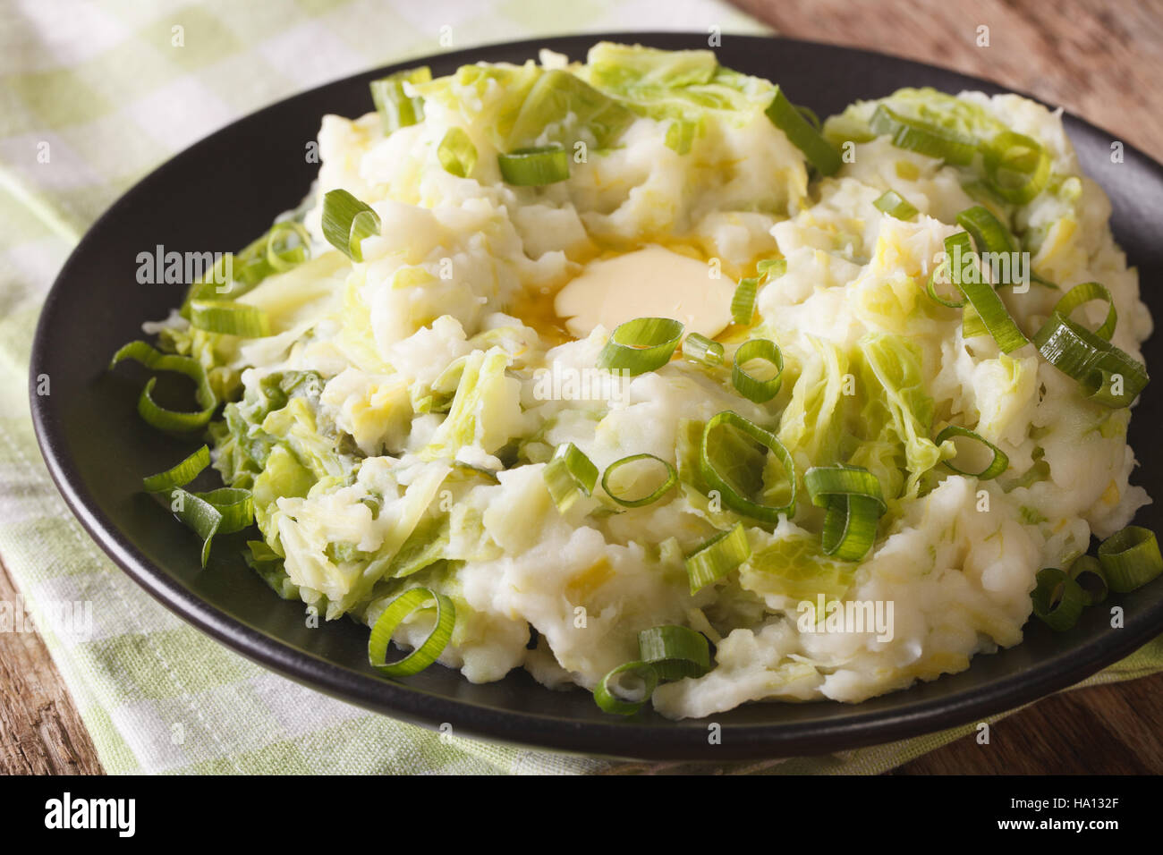 Irish colcannon mashed potatoes with savoy cabbage and butter closeup