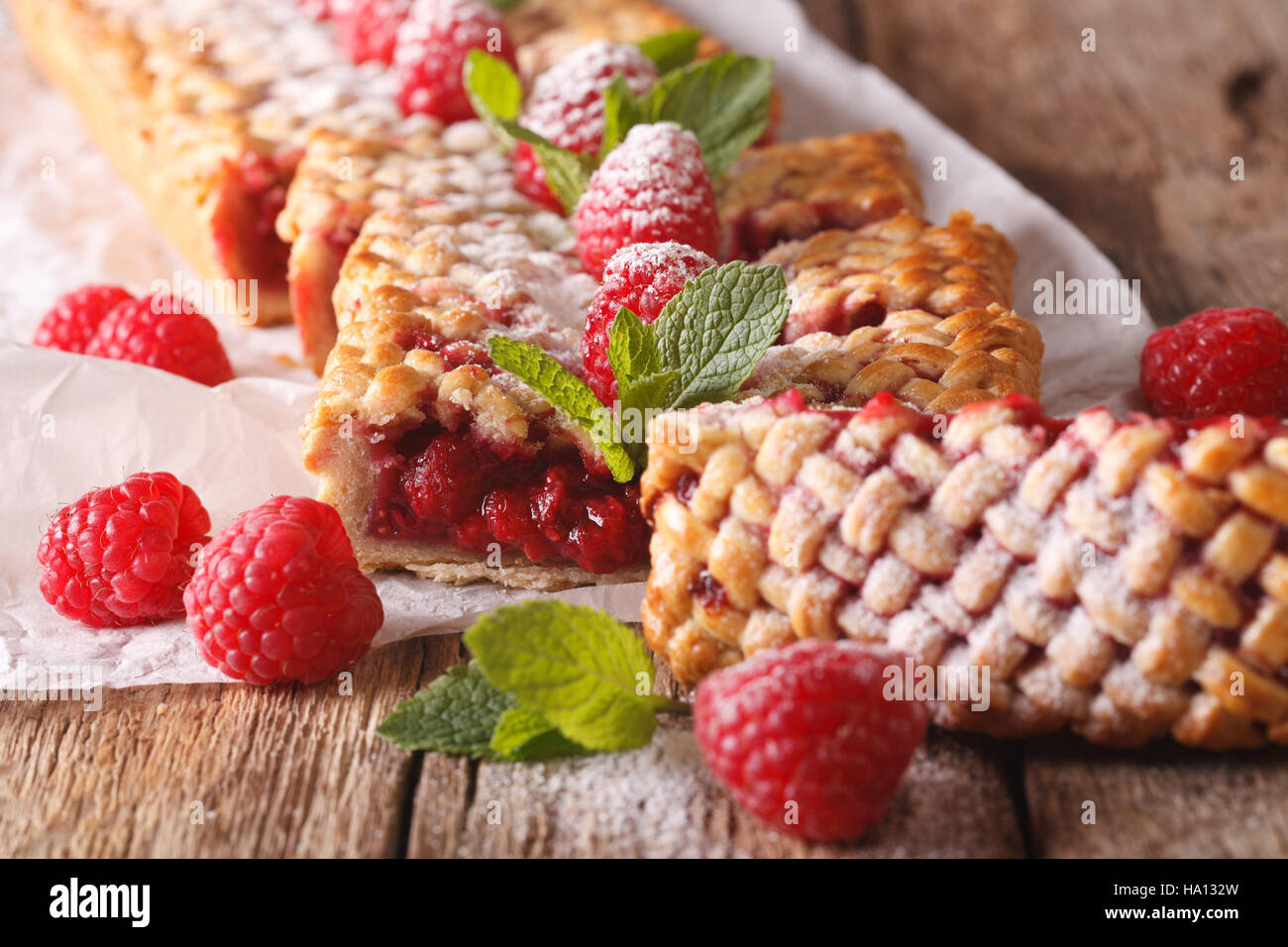 Sliced freshly baked raspberry pie close-up on the table. Horizontal ...