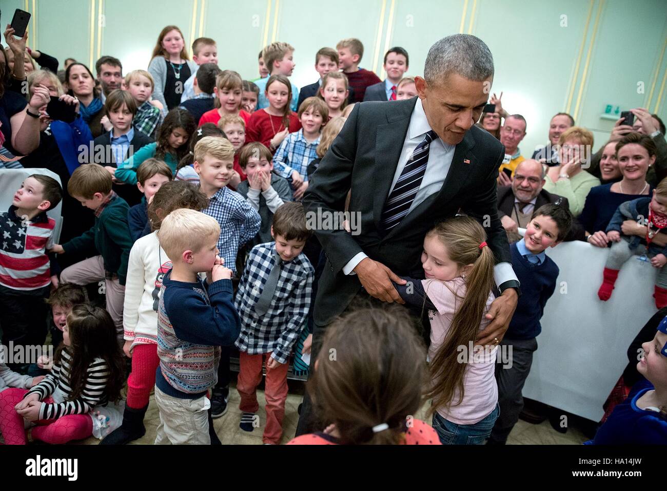 U.S. President Barack Obama greets children during the U.S. Embassy meet and greet at Hotel Adlon November 16, 2016 in Berlin, Germany. Stock Photo