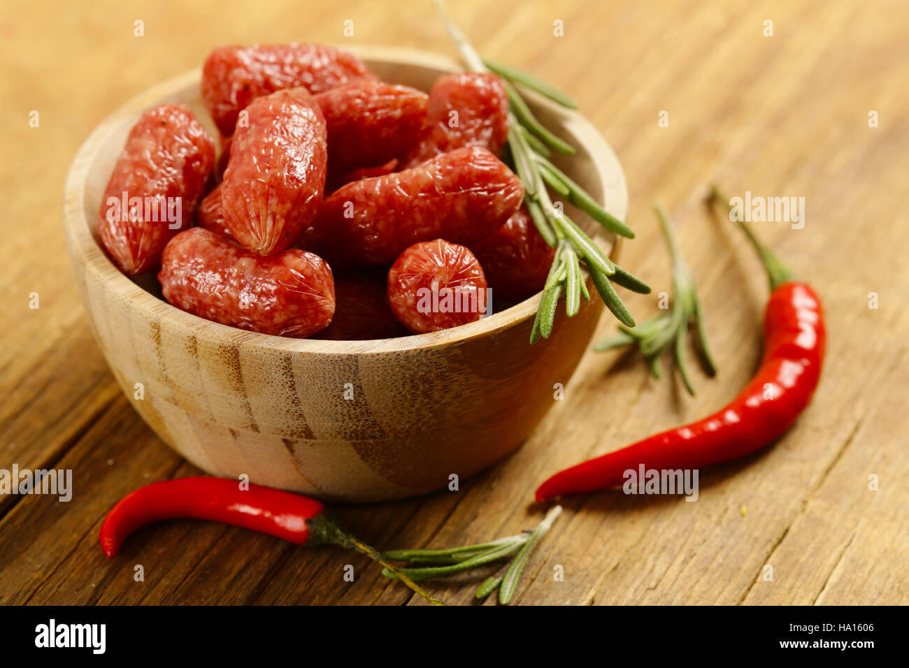 mini salami sausages on wooden table, organic product Stock Photo Alamy