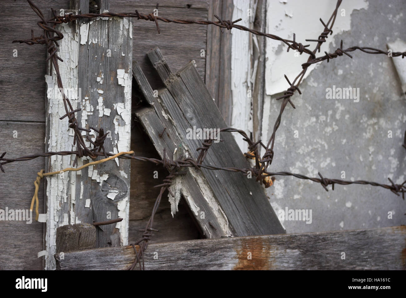 old abandoned grey wooden fence barbed wire Stock Photo - Alamy