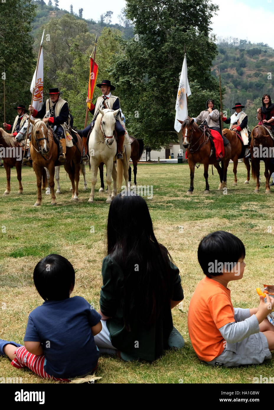 This image captures children observing wild horses in the Anza-Borrego ...