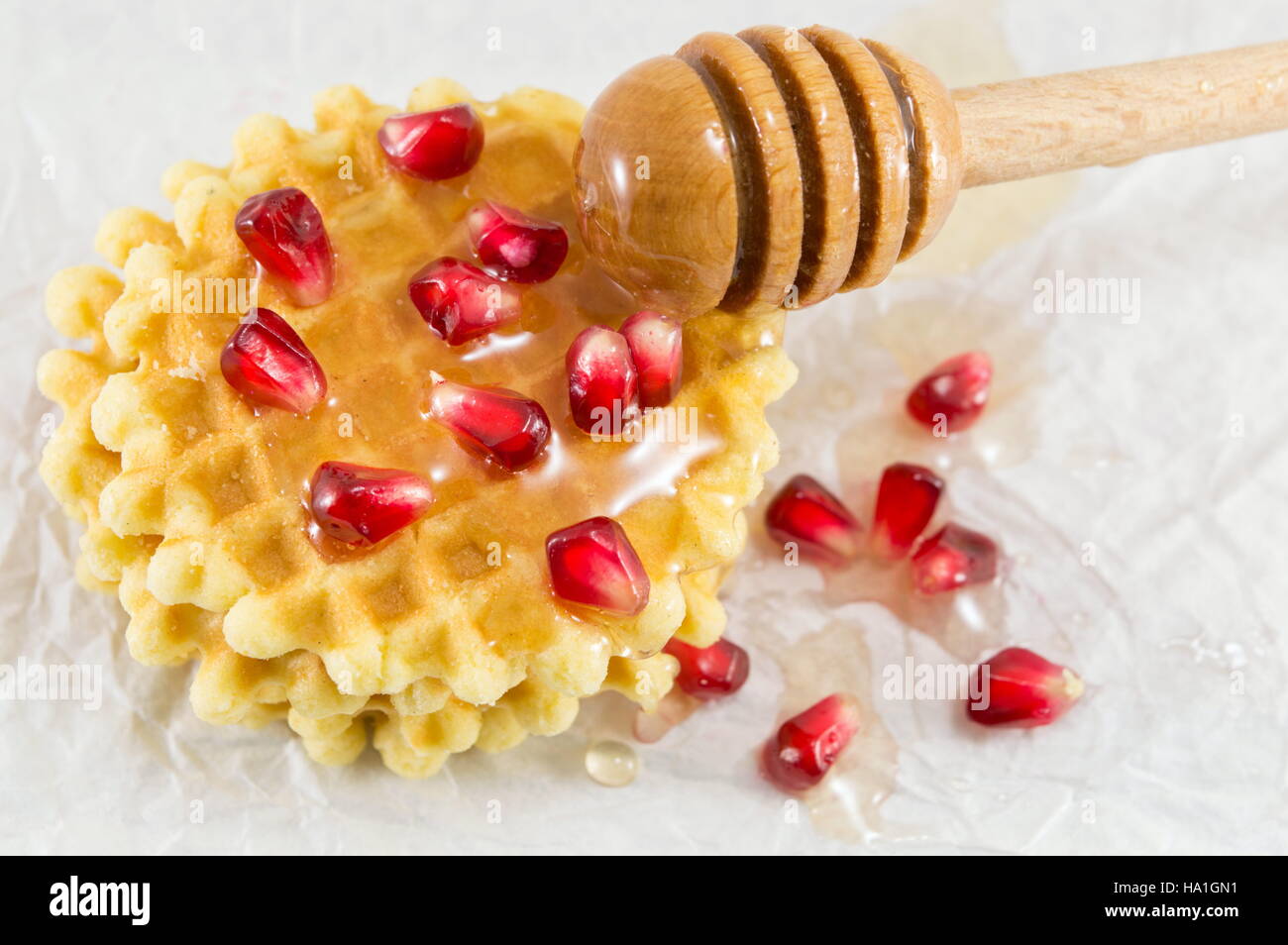 Waffle cookies with honey and pomegranate fruit Stock Photo