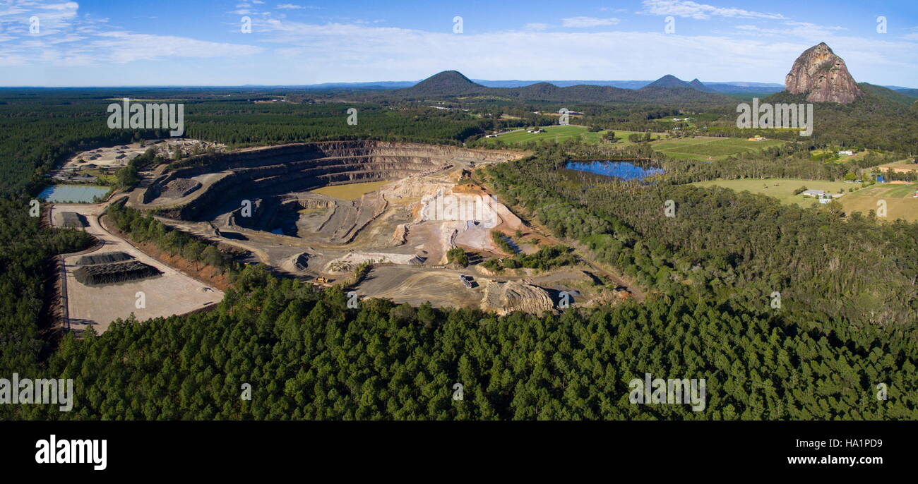 Drone aerial photo over a quarry with Glasshouse Mtns in background near Beerwah on the Sunshine Coast, Queensland, Australia. Stock Photo