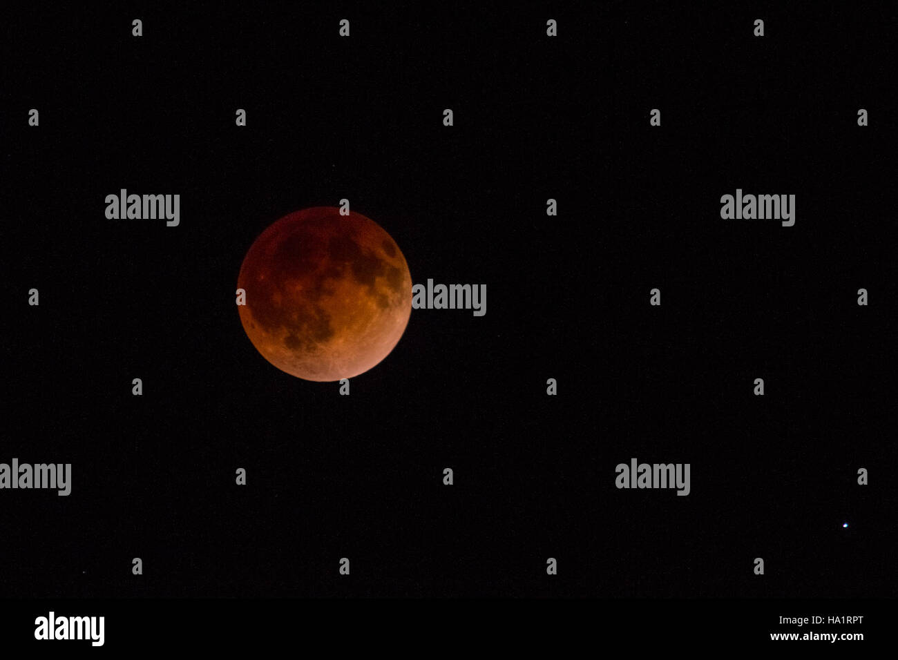 A lunar eclipse photographed at Arches National Park, showcasing the ...