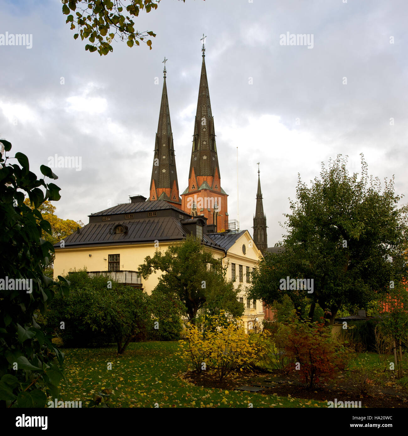 The Archbishop´s house and Cathedral in Uppsala from the garden an autumn day Stock Photo