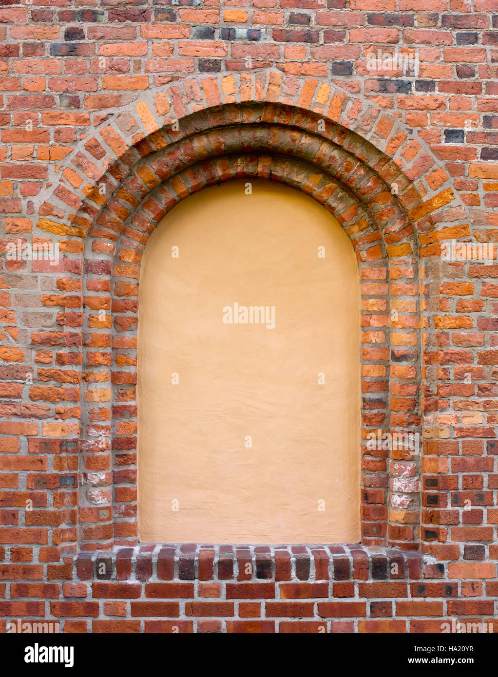 The beautiful blind window in the old brick wall Stock Photo