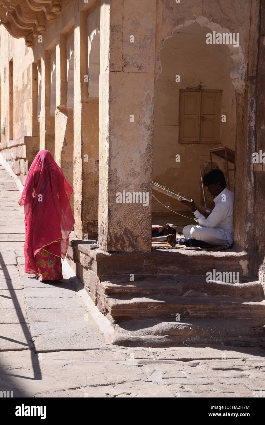 Indian guy playing a traditional instrument inside Mehrangarh fort in ...