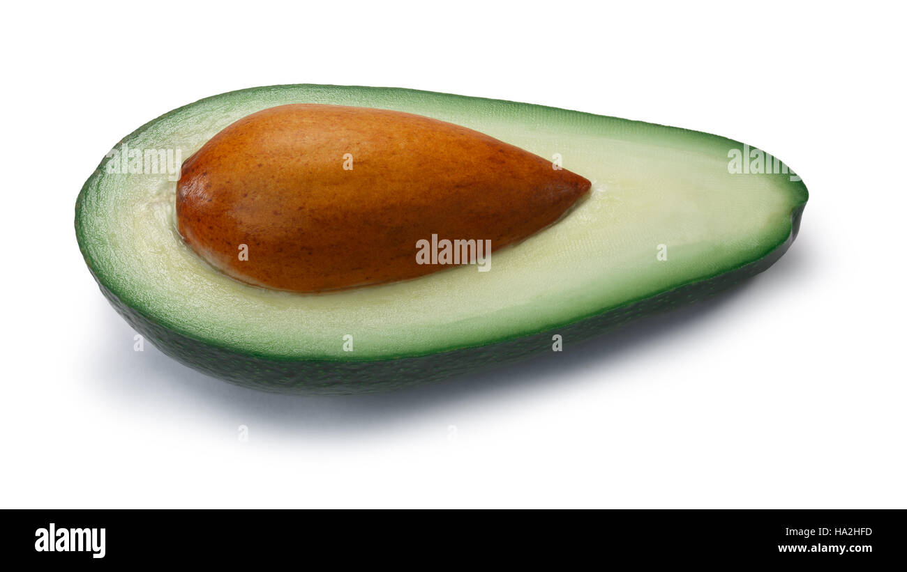 Avocado Fuerte, half with seed (Persea americana). Clipping paths, shadow separated Stock Photo