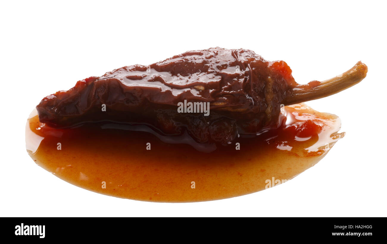 Chipotle en Adobo, a whole smokedried overripe Jalapeno pepper in