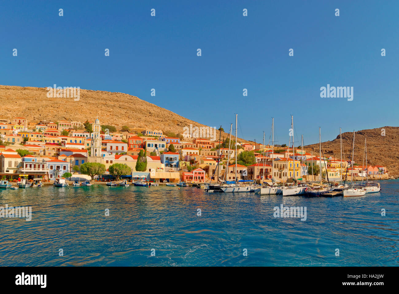 Chalki town and yacht berths, Greek island of Chalki situated off the ...