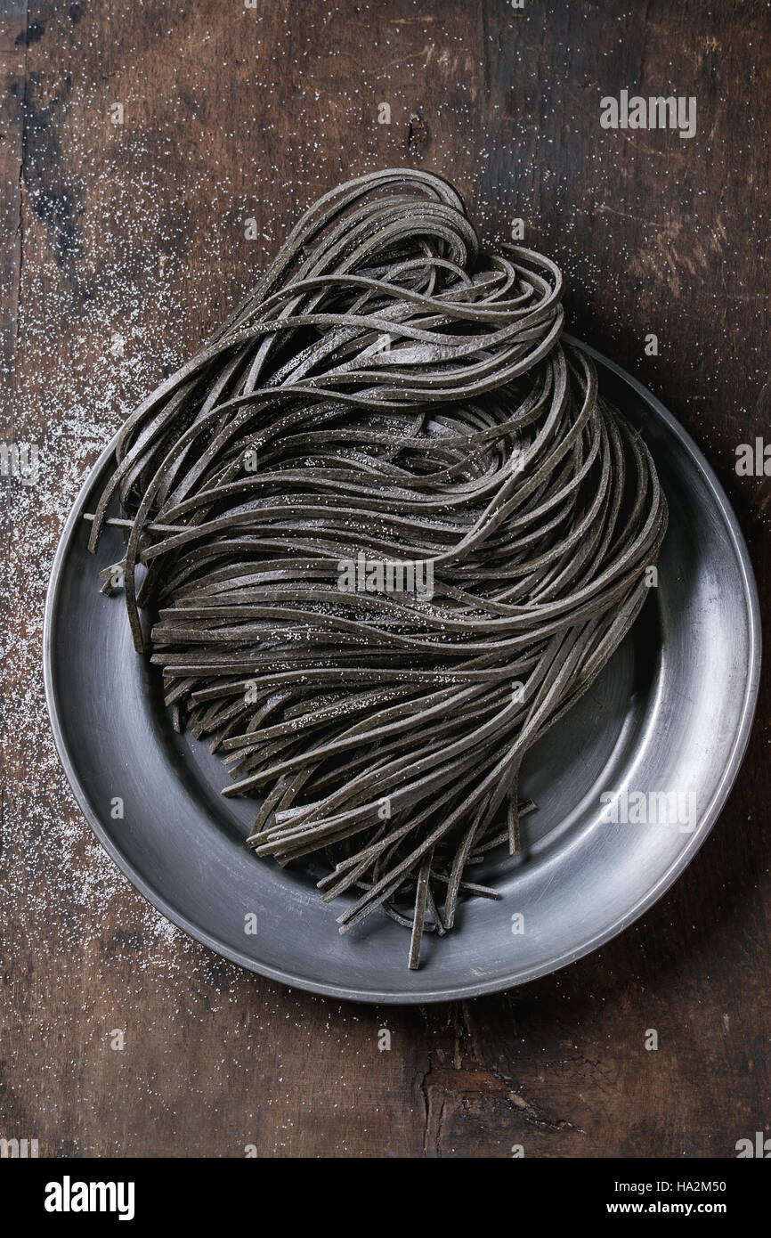 Raw black spaghetti pasta Stock Photo