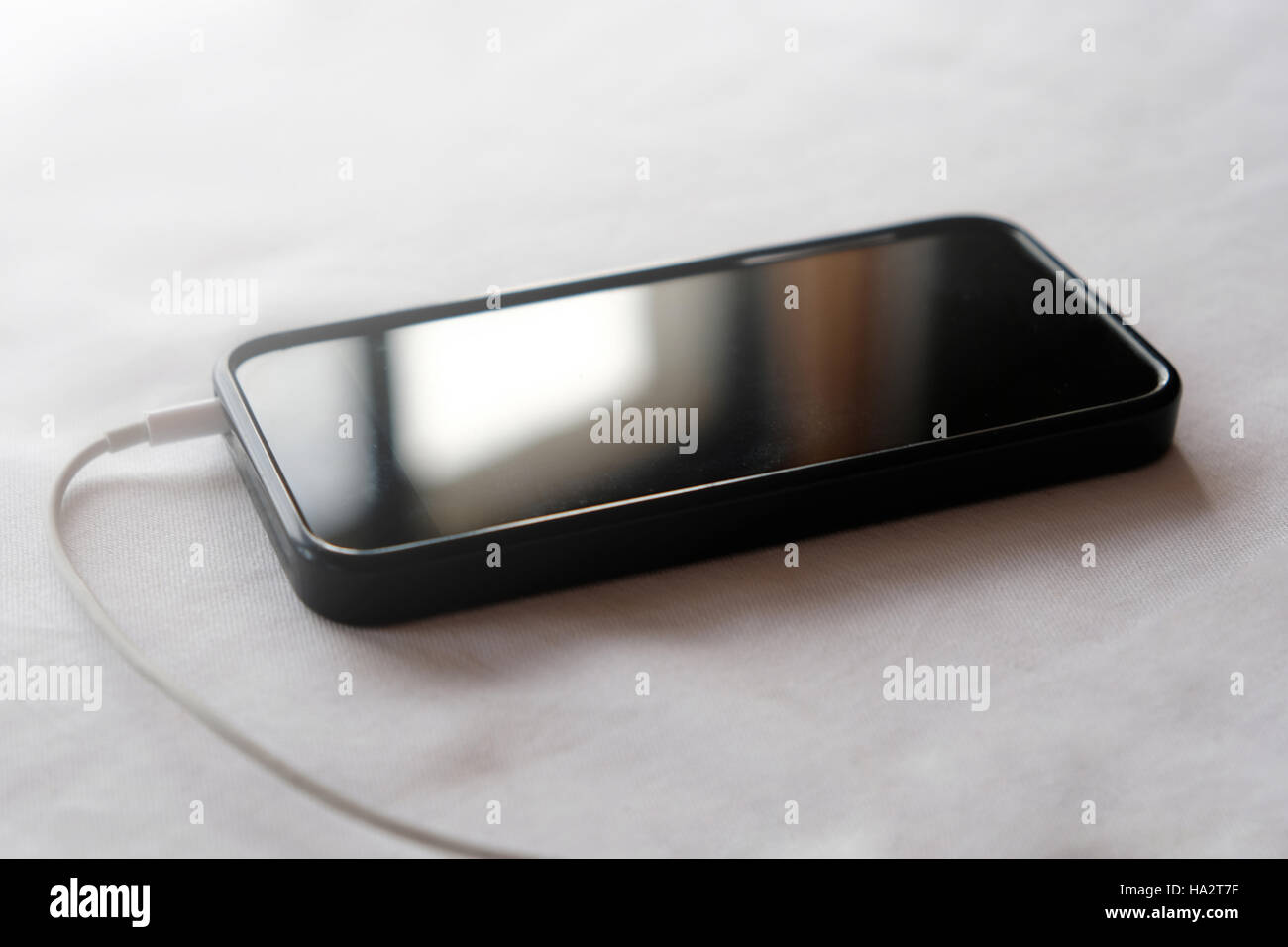 black mobile phone / smart phone charging Stock Photo