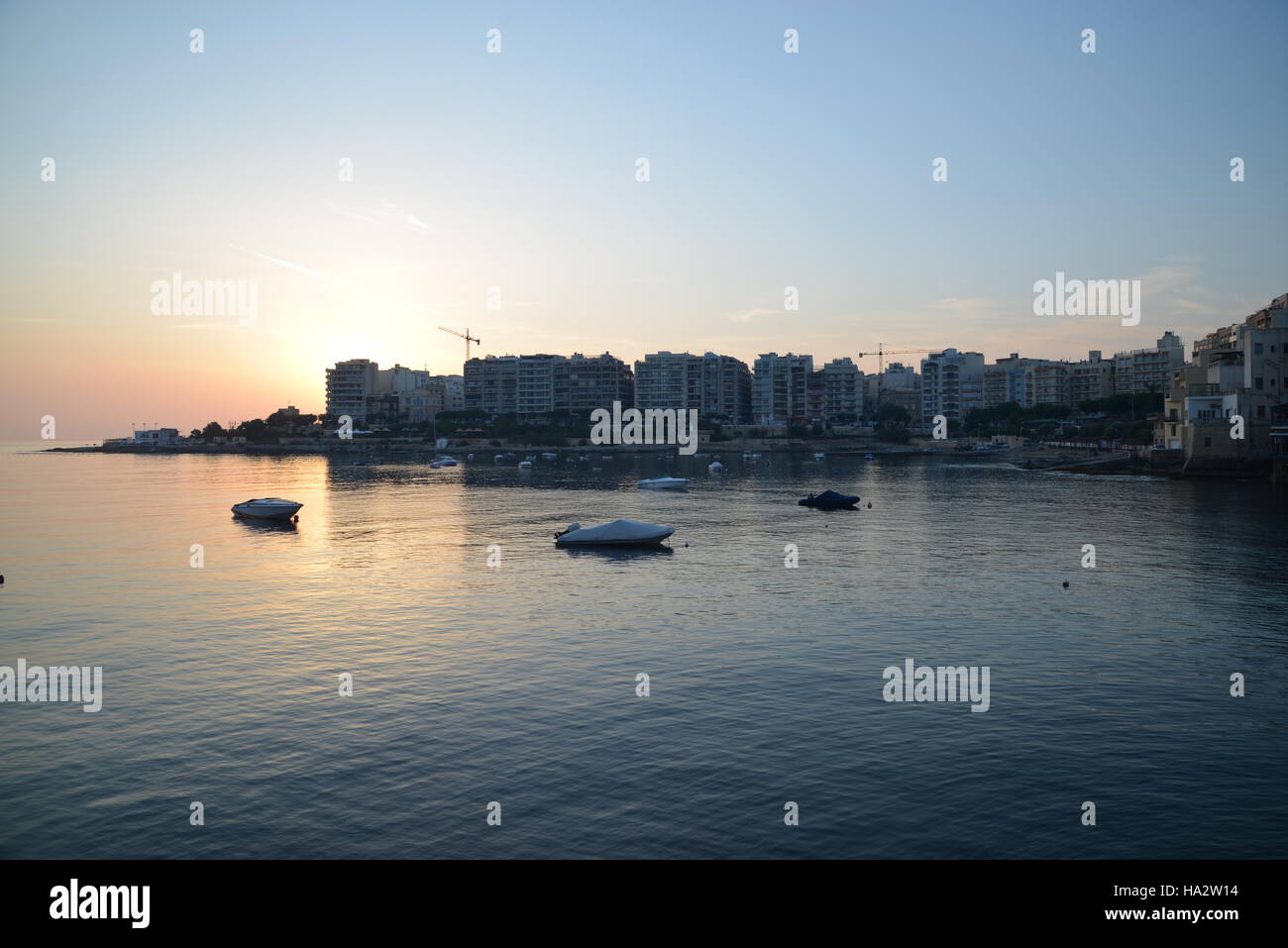 Sunrise over the Mediterranean village of Sliema, Malta, on a sunny August day Stock Photo