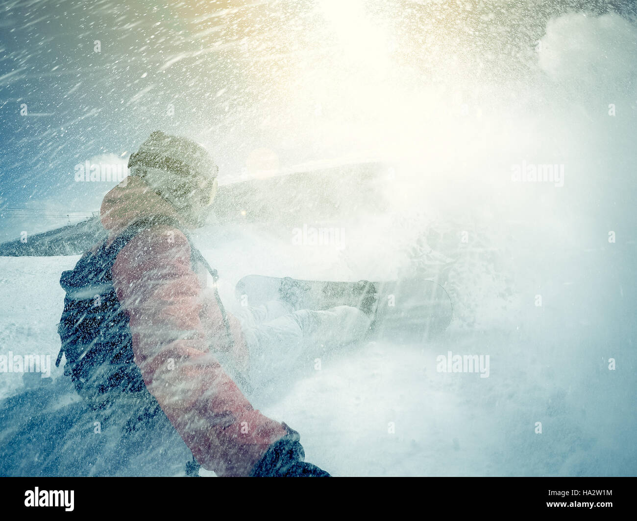 Snowboarder wiping out in snow Stock Photo