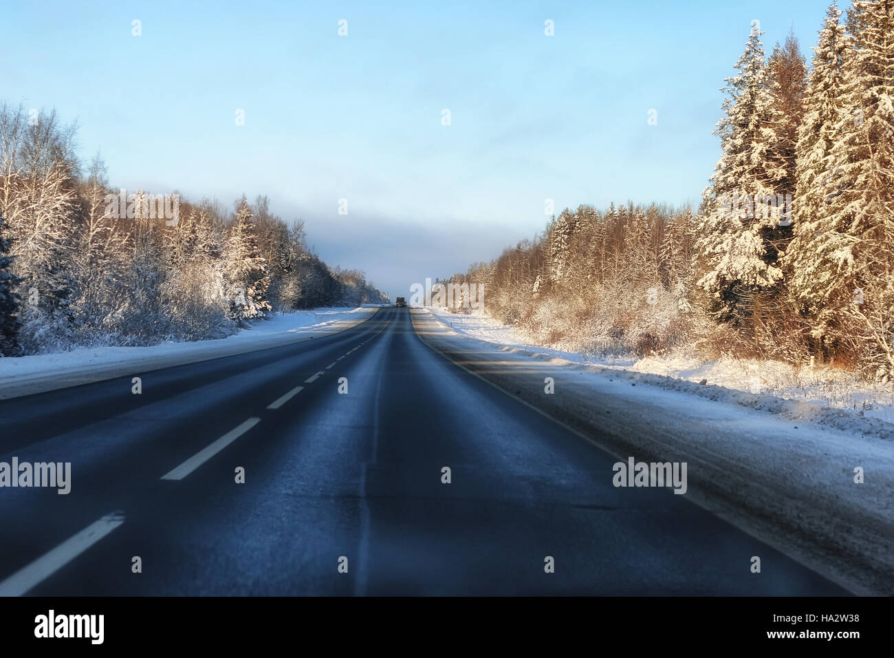 Winter road through snowy fields and forests Stock Photo - Alamy