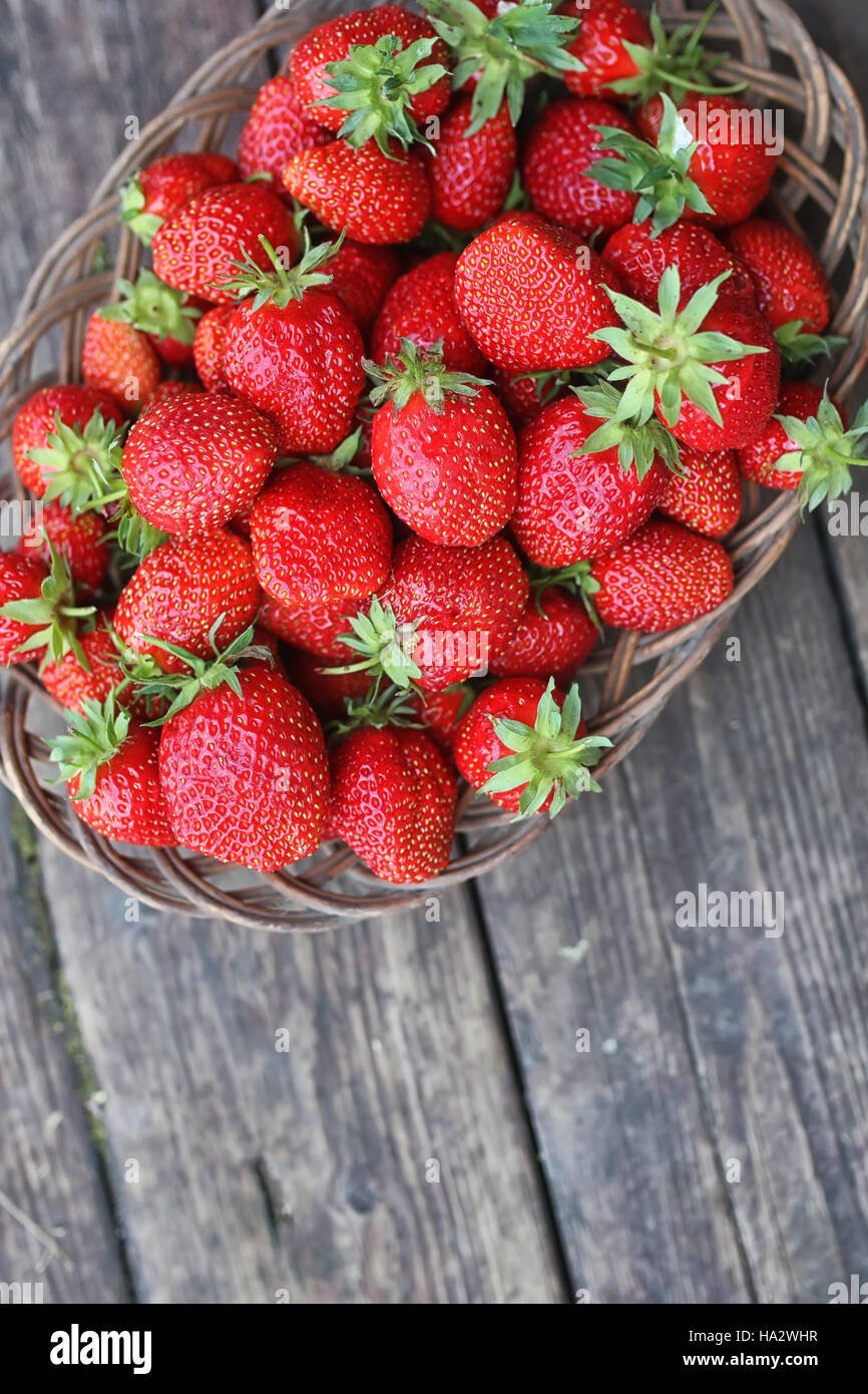 Strawberry on rustic wooden background Stock Photo - Alamy