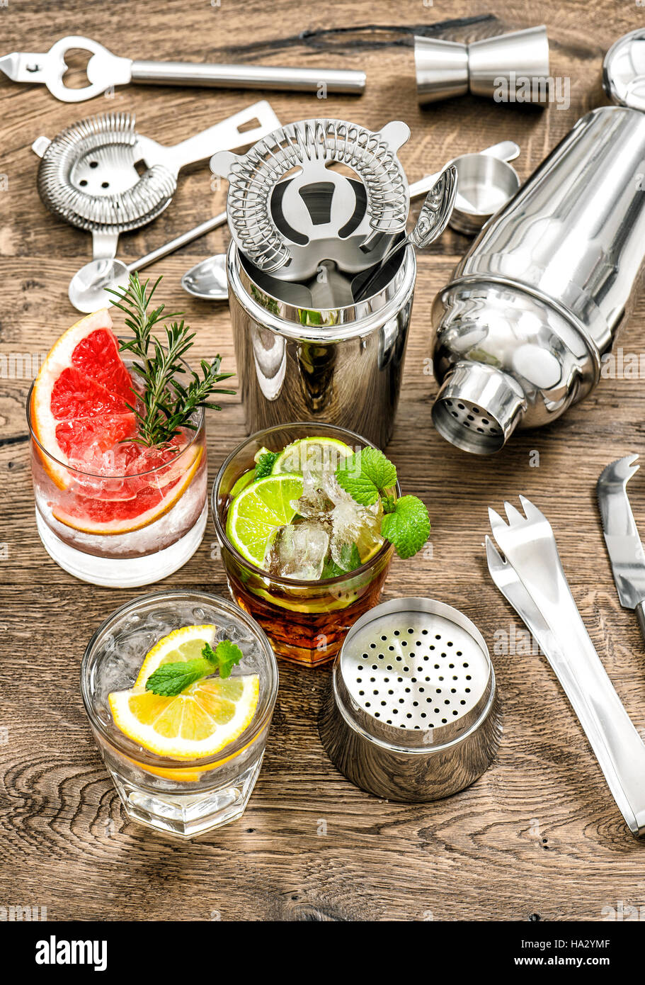 Party drinks. Cocktails with fruits and ice. Juice. Aperitif. Bar drink making tools Stock Photo
