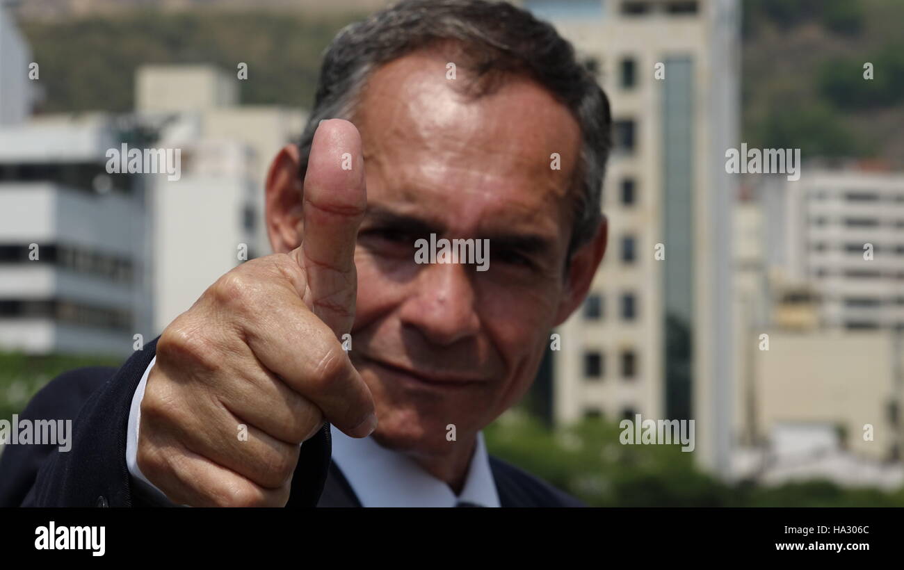 Business Man Gives Thumbs Up Stock Photo