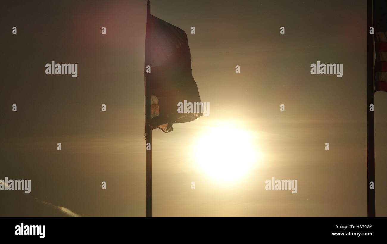 American Flag And Setting Sun Stock Photo