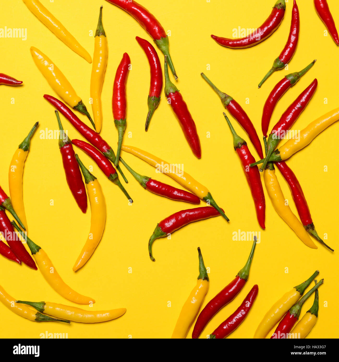Red hot chili peppers on yellow background - Flat lay Stock Photo - Alamy