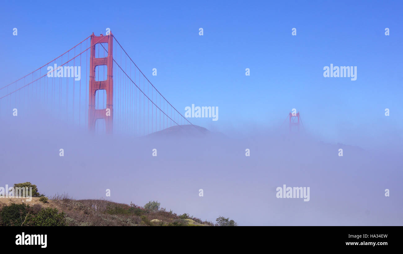 SAN FRANCISCO, USA - OCTOBER 5th, 2014: Golden Gate Bridge with heavy mist or fog as seen from Fort Point Stock Photo