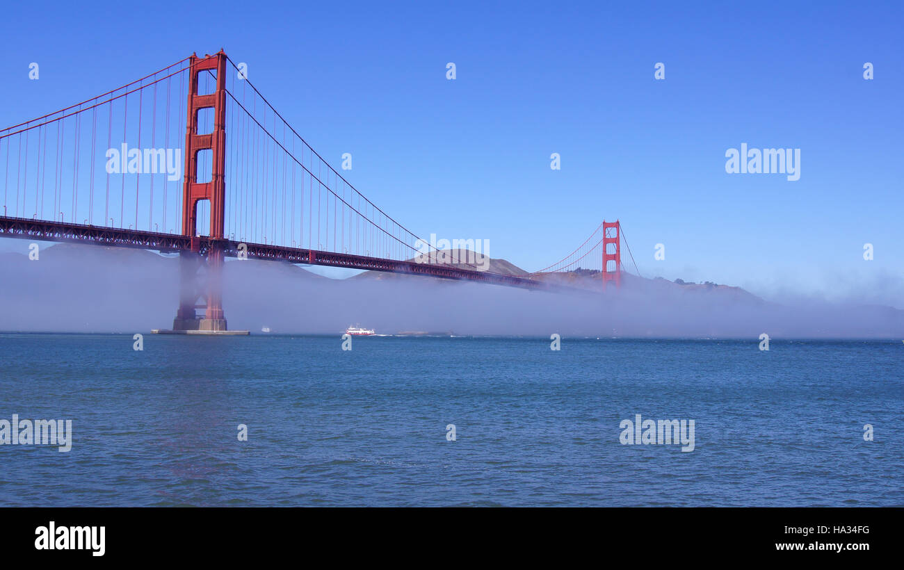 SAN FRANCISCO, USA - OCTOBER 5th, 2014: Golden Gate Bridge with heavy mist or fog as seen from Fort Point Stock Photo