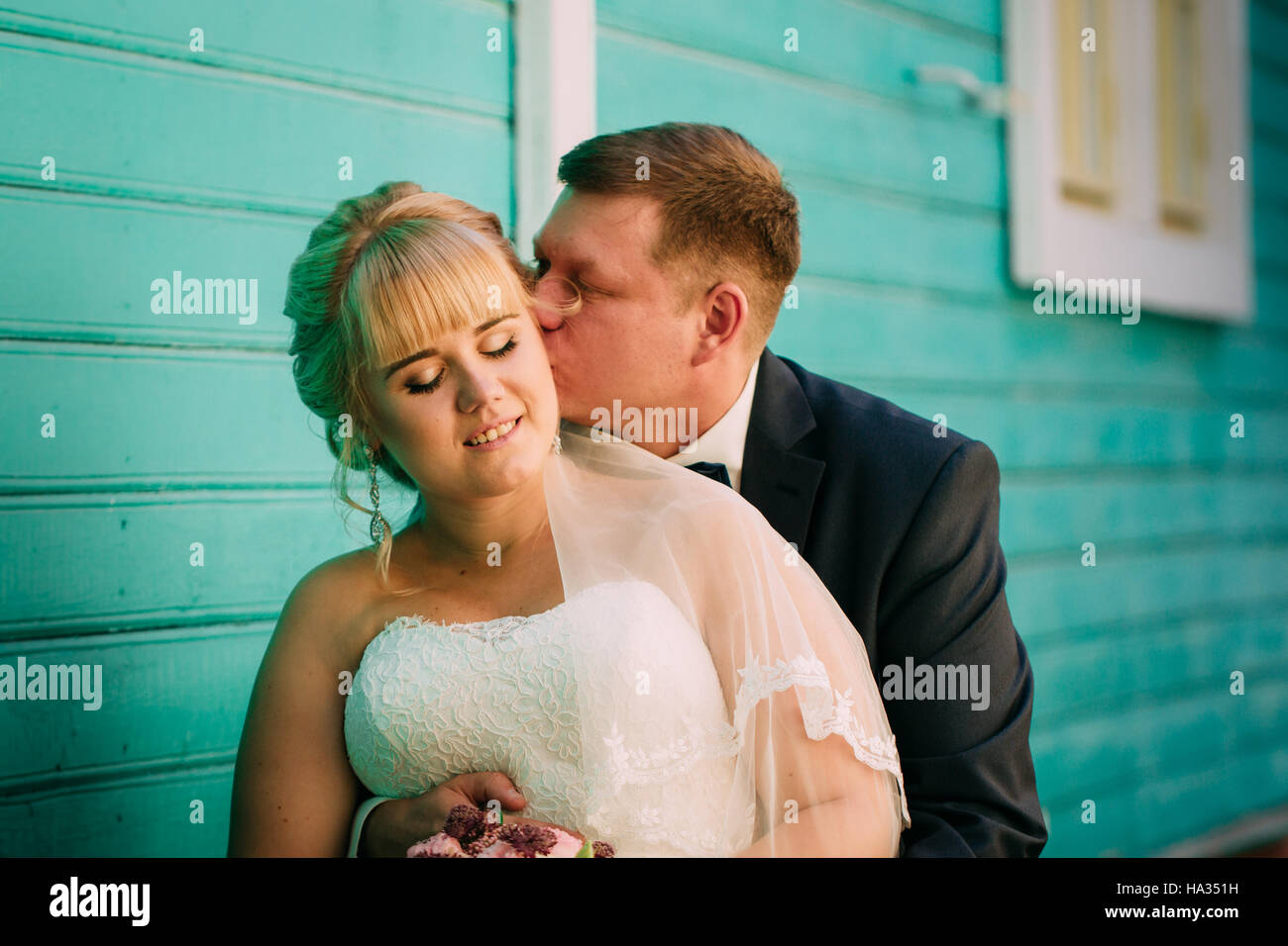bride and groom on the background of the city Stock Photo - Alamy