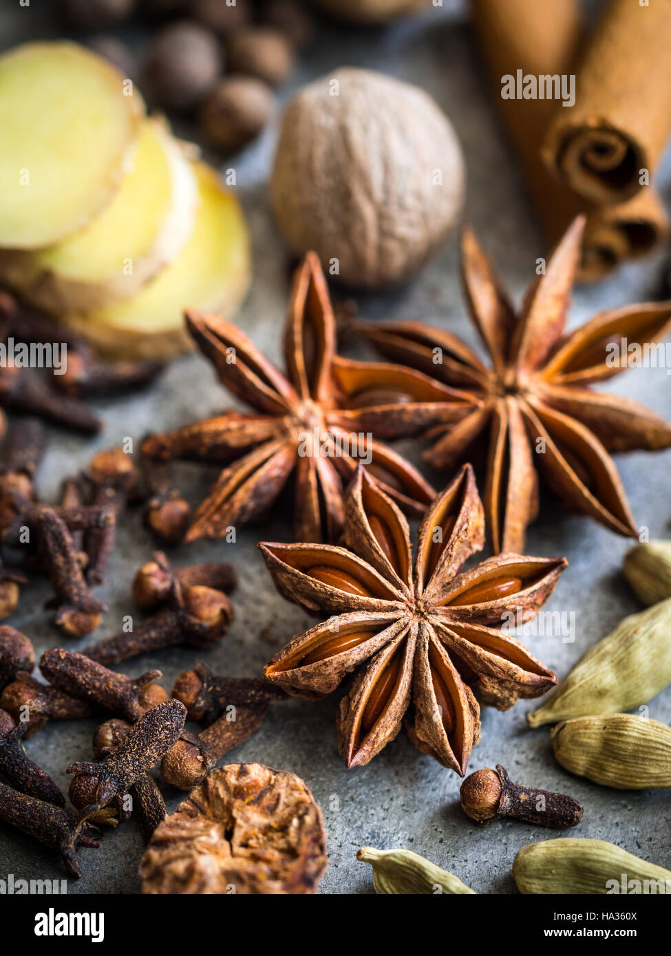 Spices for making gingerbread spice mix. Anise star in focus. Stock Photo