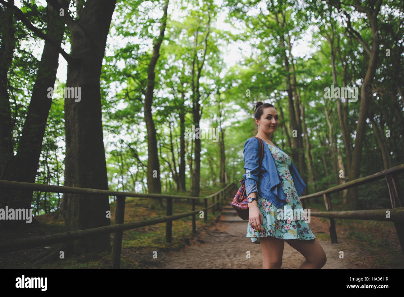 Young girl on a walk in the forest Stock Photo - Alamy