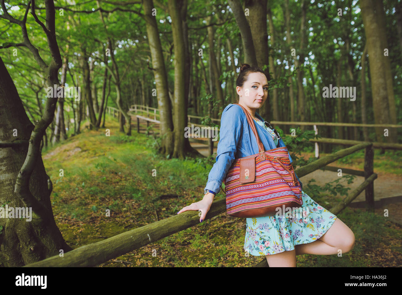 Young girl on a walk in the forest Stock Photo - Alamy