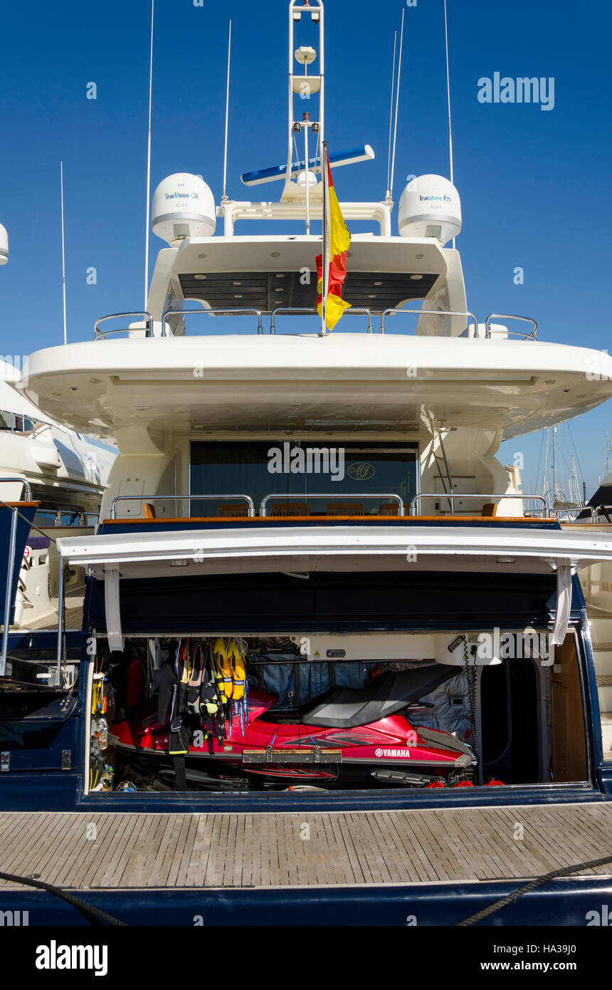 Back of a luxury yacht with jet ski in locker room, Spain Stock Photo