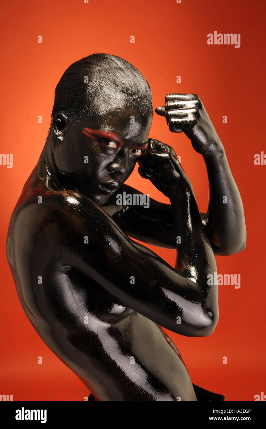 Woman body painted in black hi-res stock photography and images - Alamy