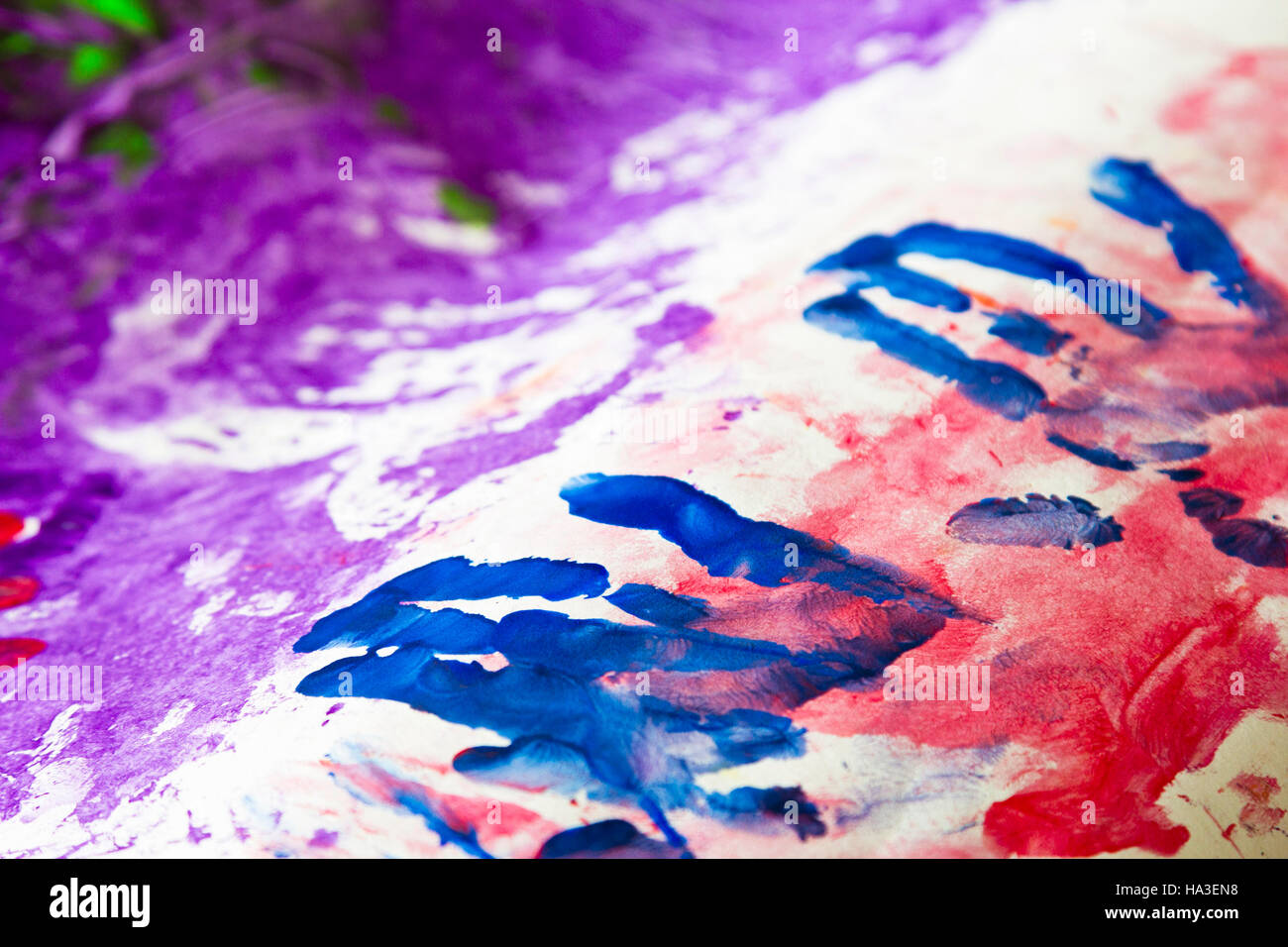 Colourful childrens' hand painting Stock Photo