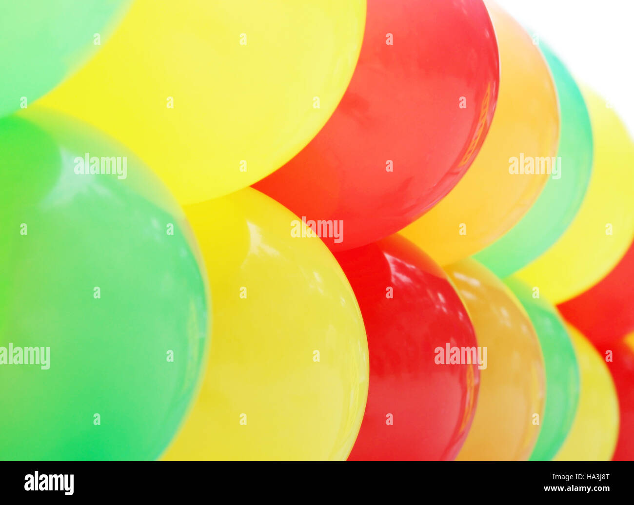 colorful festive balloons arranged in rows in the sausage Stock Photo