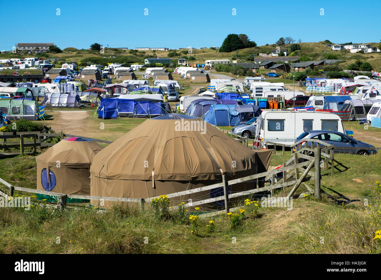 Tents and caravans at Perran sands holiday camp in Perranporth, Cornwall, UK Stock Photo