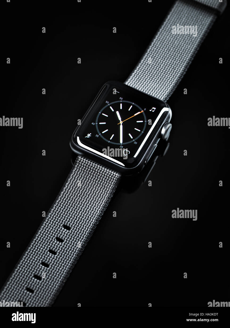 Apple Watch smartwatch with analogue clock dial on display isolated on black background Stock